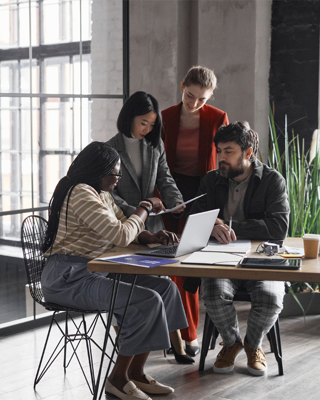 Group of people in the SEM digital marketing team working in office at Eskay Marketing.