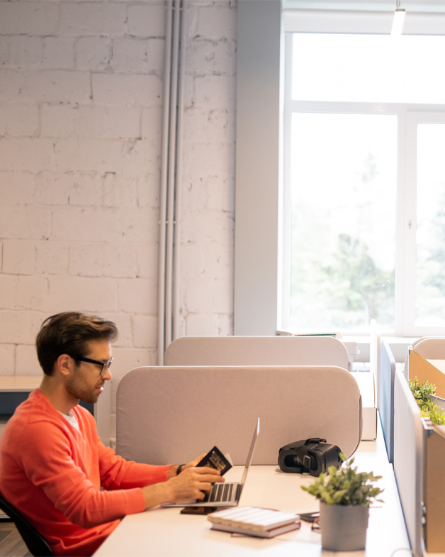 Employee of Eskay Marketing working at his desk